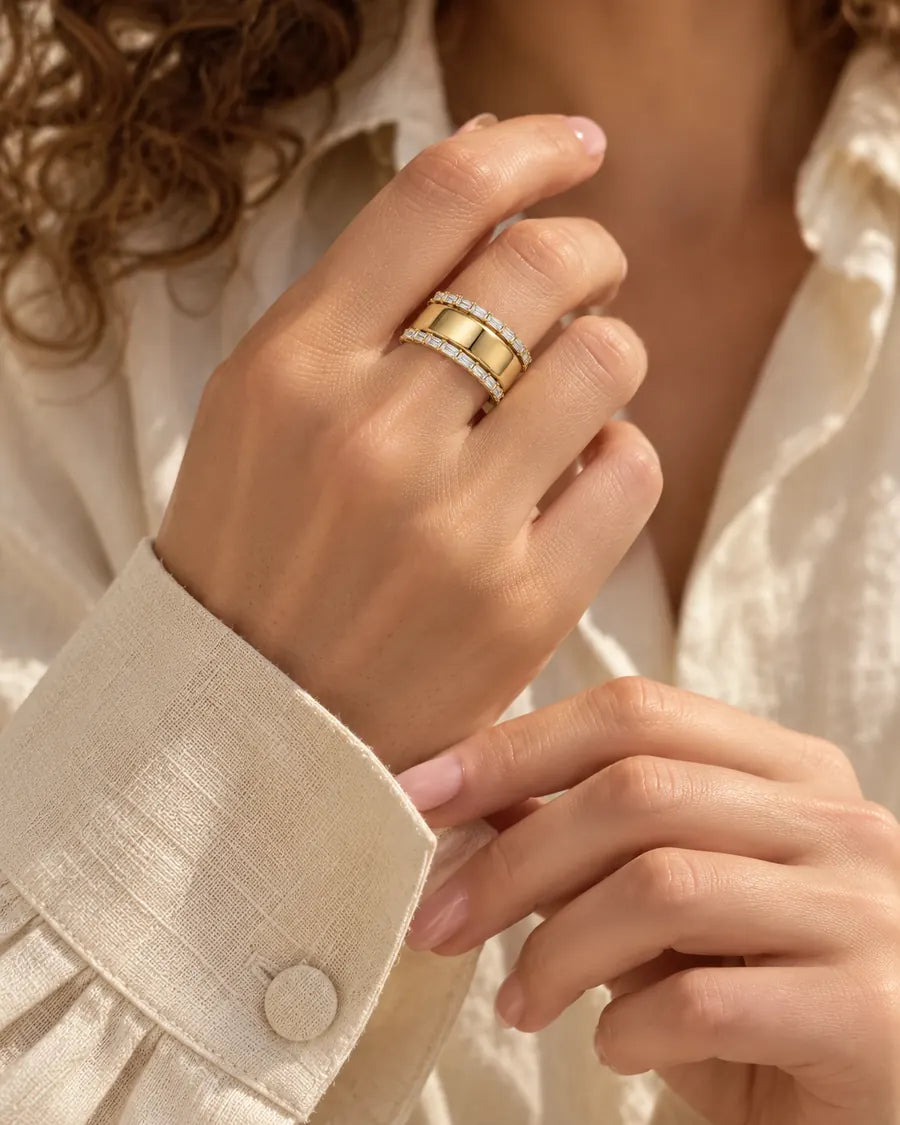 HALO Baguette in 14k yellow gold, worn over an Oura Ring with an ivory linen shirt