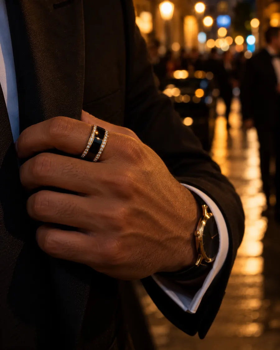 Man in a suit wearing HALO Round in 14k yellow gold over a black Oura Ring on a city street at night